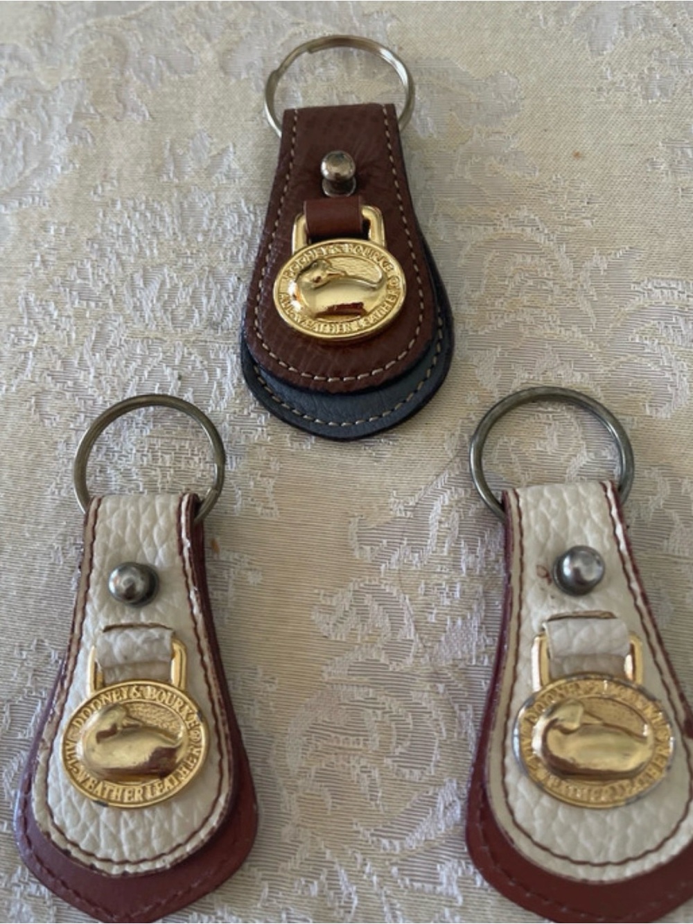 Dooney & Bourke Brown, White and Navy Leather Key Fob Trio